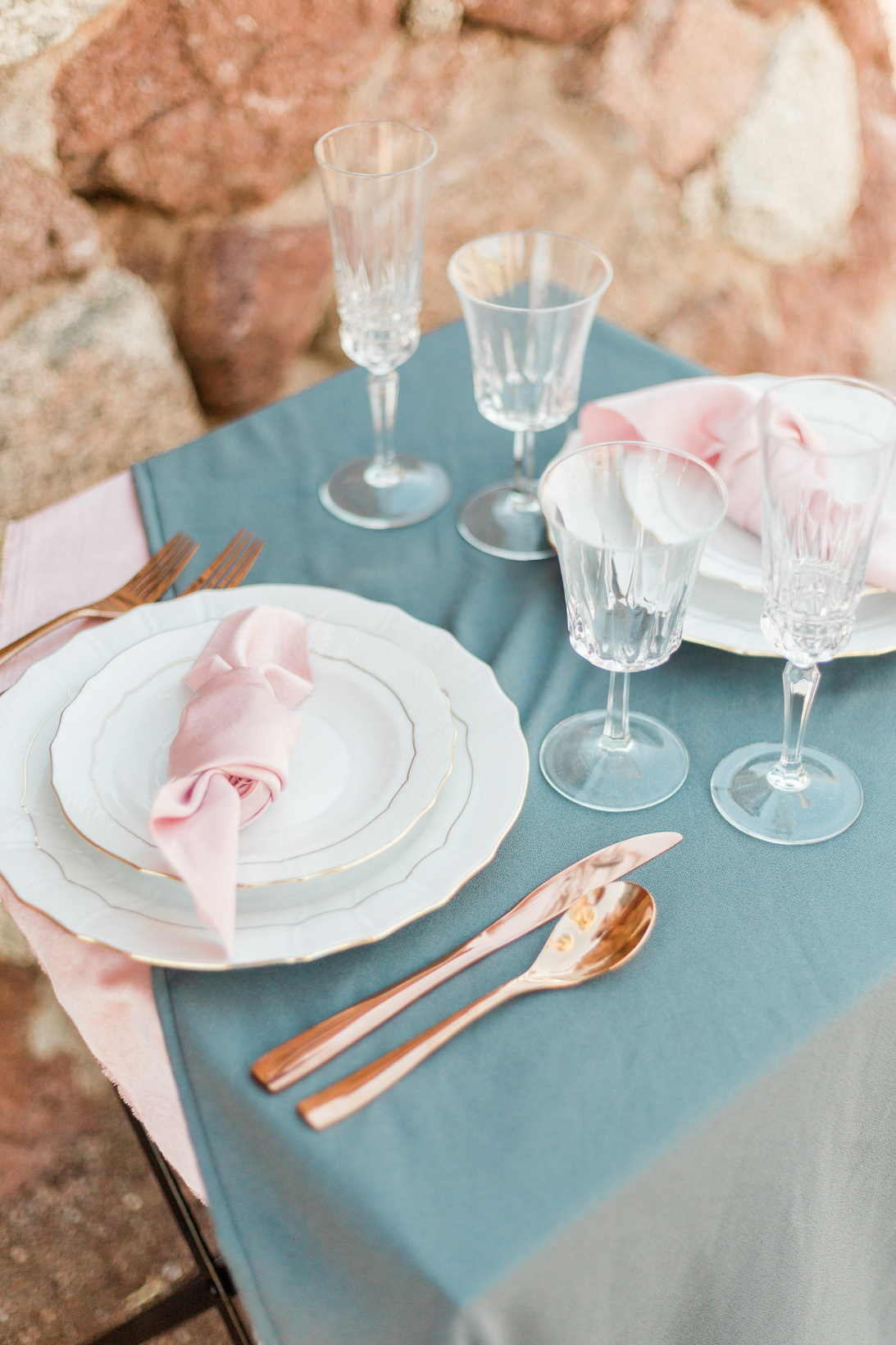 Rustic Table Setting with Dishware, Utensils and Glasses Outdoors